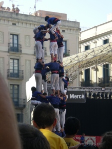 Castells are human towers that just pop out of the crowd out of nowhere... a small kid climbs to the top for the finishing touch, so awesome! My video was really shaky, but click http://video.google.es/videosearch?hl=es&source=hp&q=castells&um=1&ie=UTF-8&sa=N&tab=wv#q=castells+barcelona&hl=es&emb=0 here to view some examples posted online. 